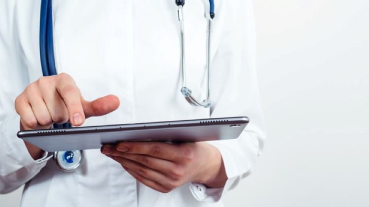 doctor with a tablet